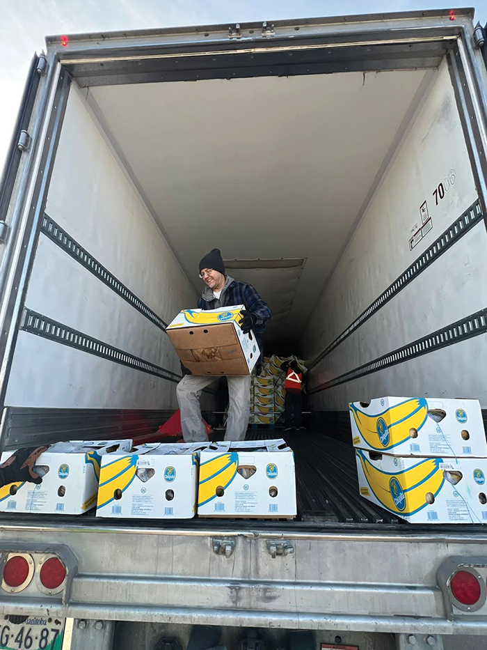 The Moosomin Food Share unloading 11 pallets of bananas